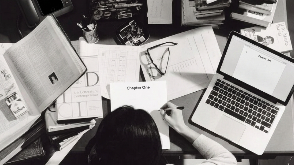 Cluttered desk with printed papers and a mostly blank thesis document, illustrating research without structure